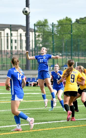 Audrey Singer jumps up for a header.