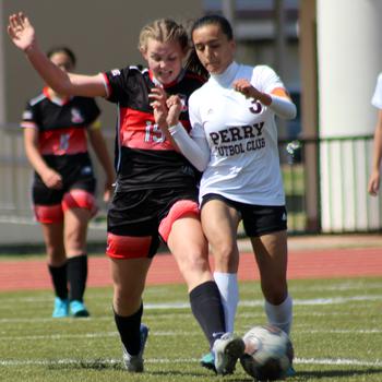 E.J. King's Madylyn O'Neill and Matthew C. Perry's Hailey Gibbs battle for the ball during Saturday's DODEA-Japan soccer match. The teams battled to a scoreless draw, the Samurai's eighth tie of the season and the Cobras' ninth.