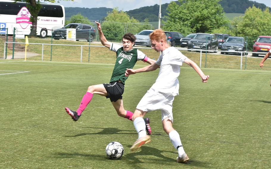 AFNORTH's David Immel tries to get in the way of a shot from Sigonella's Cameron Evans on Monday, May 16, 2022, at the DODEA-Europe boys Division III soccer championships at Reichenbach, Germany.