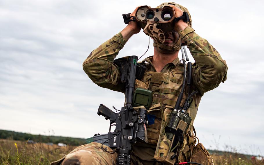 A U.S. Army paratrooper assigned to the 173rd Airborne Brigade surveys the land at a drop zone during training near Yavoriv, Ukraine in September 2021. A recent Rand Corp. study suggests the Army should emphasize lighter units over tanks as a deterrent against Russia. 