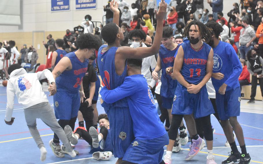 Players and fans celebrate the Ramstein Royals winning the DODEA-Europe Division I boys basketball championship on Saturday, Feb. 22, 2022.