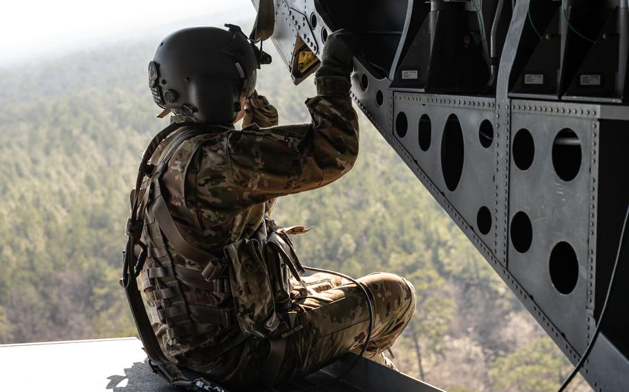 Mississippi National Guard Staff Sgt. Tres Dobbins, CH-47 Chinook crewman, Company B of the 1st Battalion, 111th Aviation Regiment, Meridian, Miss., supports aerial transportation of participants during PATRIOT 24, Camp Shelby, Miss., on Tuesday, Feb. 20, 2024.
