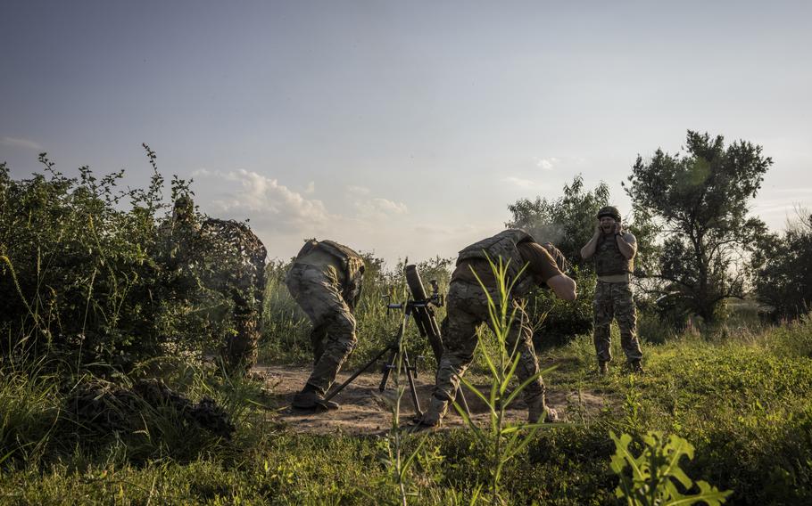 Soldiers from the 3rd Assault Brigade prepare to fire mortar rounds at a base between Klishchiivka and Kostyantynivka on July 5, 2023. 