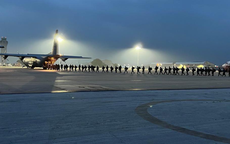 Members of the Texas Army National Guard load a C-130 cargo aircraft Monday, May 8, 2023, at Austin-Bergstrom International Airport in preparation to fly to El Paso as part of a state-wide mission to reinforce border operations in anticipation of the end of Title 42 immigration restrictions. 