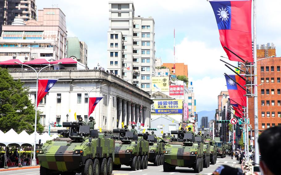 Tanks pass in front of the Presidential Office during the National Day celebration in Taipei, Taiwan, on Oct. 10, 2021.