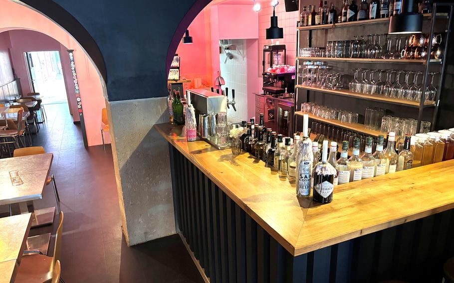 A bar lined with beverage bottles.