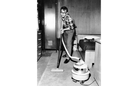 Seoul, South Korea, December 1960: Robert Harilee vacuums his room at Pomeroy Hall. The 17-year-old lives with 11 girls and 15 boys in Pomeroy Hall while attending nearby American High School on the Seoul Area South Command Post, as there are no high schools for them to attend where their families live. 
The 27 students – all dependents of U.S. Army officers and civilian personnel in Busan, Deagu, and Uijongbu - eat all their meals during the week in the high school cafeteria, but go home on the weekends when the “billets” are closed.

Stars and Stripes celebrates the Month of the Military Child! Check out stories and drawings of dozens of "military brats" here.https://militarychild.stripes.com/

META TAGS: Month of the Military Child; DODEA; DODDS; dependents; military family;