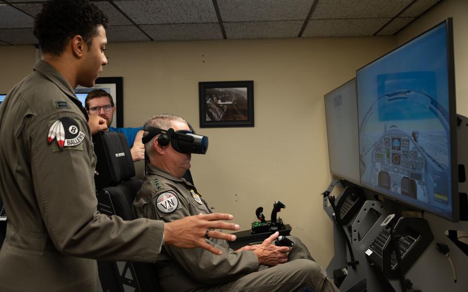 Gen. Mike Minihan, the commander of Air Mobility Command, flies a Common Immersive Training Device as part of his visit to Vance Air Force Base, Okla., Aug. 26, 2022.