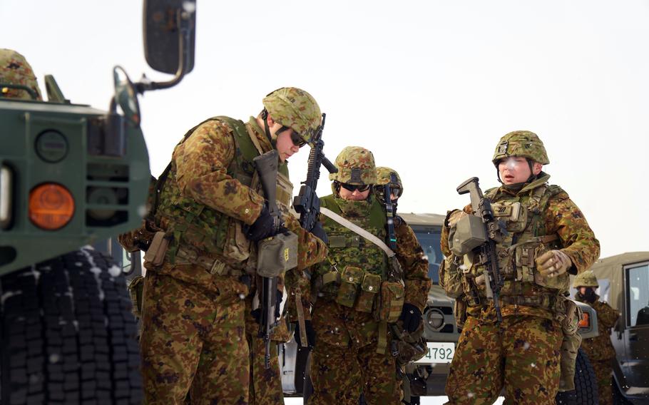 Japanese soldiers prepare for cold-weather training with their U.S. counterparts during the North Wind exercise at Camp Higashi Chitose, Hokkaido, Friday, Jan. 26, 2024.