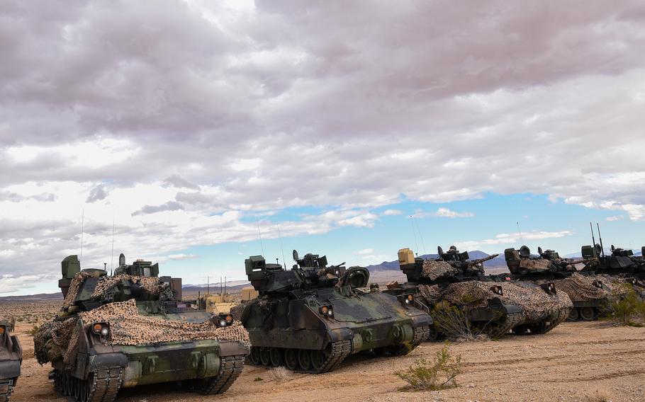 M2A4 Bradley Fighting Vehicles from 2nd Armored Brigade Combat Team, 3rd Infantry Division line up during a pause in fighting Feb. 27, 2023, during a force-on-force battle at the Army’s National Training Center at Fort Irwin, Calif. 