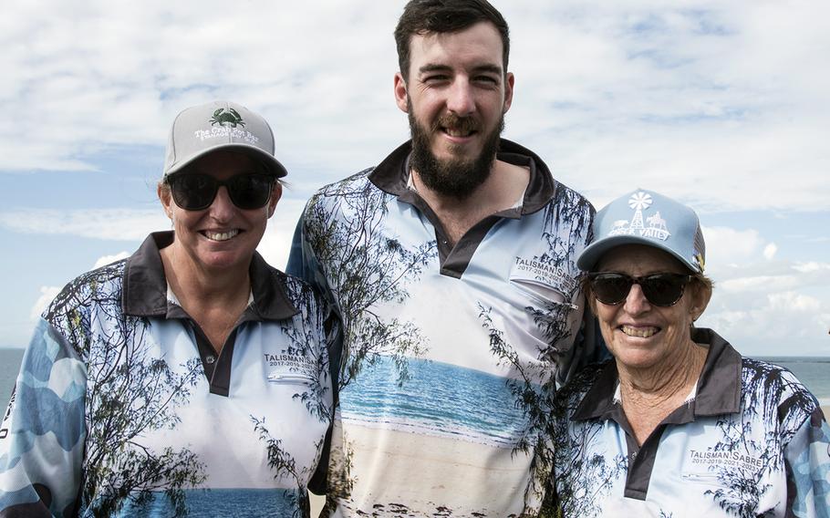 Nicole Svendsen, left to right, Wiliam Svendsen and Yvonne Burns pose near Langham Beach during Talisman Sabre training near Stanage Bay, Australia, Wednesday, Aug. 2, 2023. 