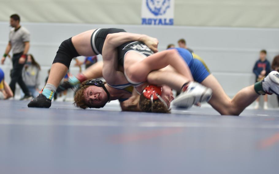 Wiesbaden’s Jacob Lane tries to pin AFNORTH’s James Bennett in the finals at 144 pounds at the DODEA-Europe wrestling sectional tournament at Ramstein High School, Germany, on Saturday, Feb. 3, 2024.