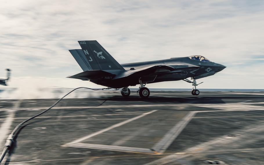An F-35C Lightning II assigned to Strike Fighter Squadron 147 lands on Nimitz-class aircraft carrier USS George Washington on Dec. 8, 2023. Despite plans to operate the F-35 through 2088, the Air Force and Navy are now working to develop sixth-generation fighters along with Collaborative Combat Aircraft (CCAs), autonomous drones that can tether to fighters or perform missions independently, all of which they plan to field in the 2030s.