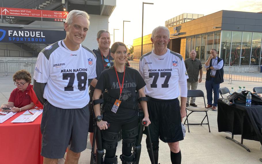 Brittany Elliott at the congressional football game in 2023. She is pictured with Denis McDonough, secretary of the Department of Veterans Affairs, Rep. Jack Bergman, R-Mich., and her father, Morgan Elliott.