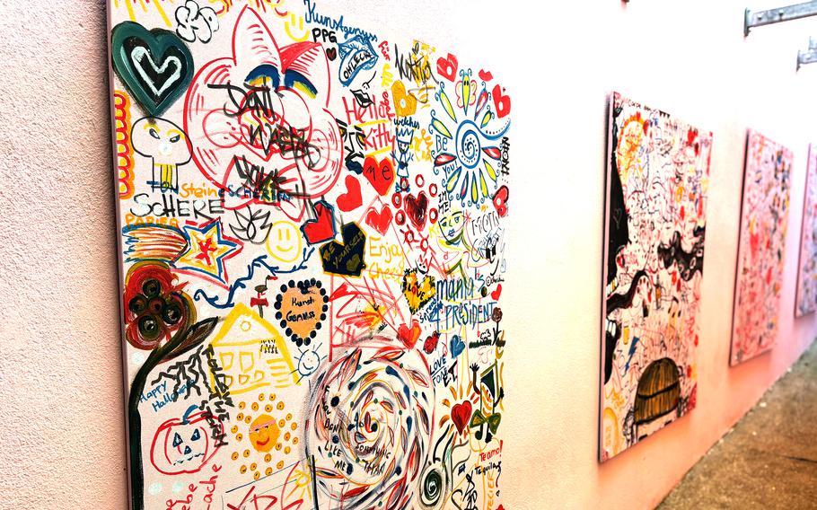 Art hangs on a bar’s wall.