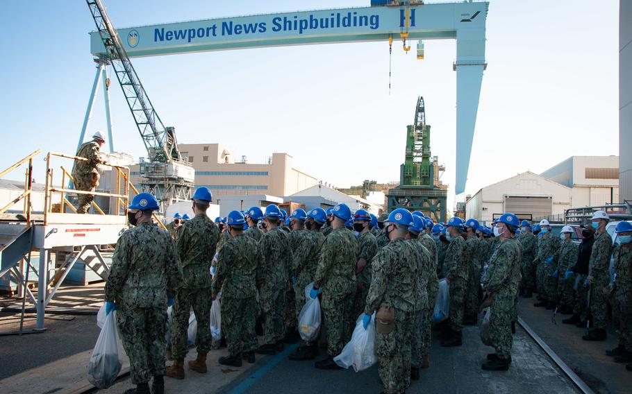 Sailors from USS John C. Stennis finish a foreign object debris walkdown at the Newport News Shipbuilding dry dock where their ship will spend the next four years. 