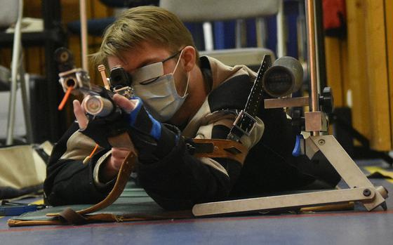 Wiesbaden's Eamon Stackpole takes aim at his targets in the prone position during a marksmanship meet in Wiesbaden on Saturday, Jan. 29, 2022.
