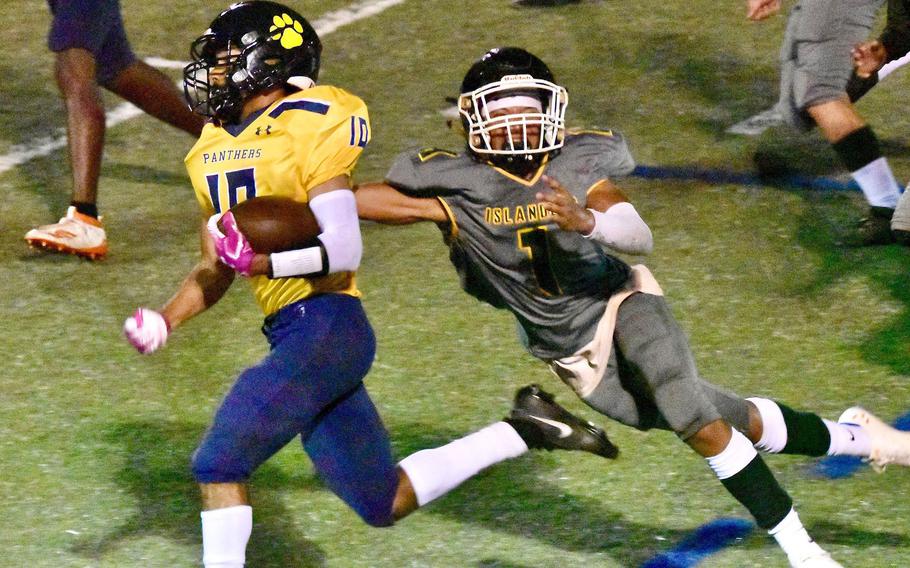 Panthers running back Alex Gallego leaves JFK's Trey Fields in his wake as he runs for a touchdown.