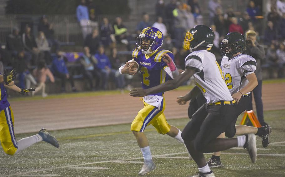 Yokota's Dylan Tomas runs with the ball during the homecoming game between Edgren and Yokota on Friday, Nov. 5, 2021.