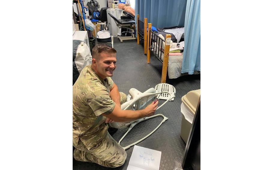A member of the 379th Expeditionary Medical Group, who worked as a physical therapist before supporting Afghanistan evacuation operations, sets up bassinets to support the newborn children of evacuees at Al Udeid Air Base, Qatar. Since the base became the main stopover location for evacuees from Afghanistan on Aug. 14, 2021, members assigned to the unit helped deliver nine babies.