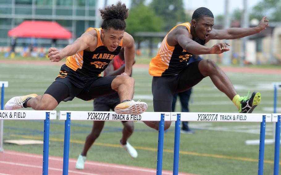 Kadena's Cameron Wilson and Quince Reese make for the finish line of the 110 hurdles in the Far East meet. Wilson edged his teammate by .03 seconds.