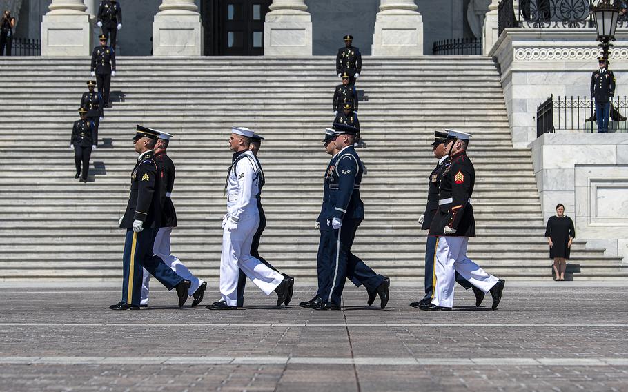 Members of a U.S. military honor guard march to a hearse to carry the casket of World War II veteran Hershel Woodrow “Woody” Williams up the steps of the U.S. Capitol, where he was to lie in honor for several hours on Thursday, July 14, 2022. Williams, who was the last living Medal of Honor recipient who fought in World War II, died on June 29. He was 98.