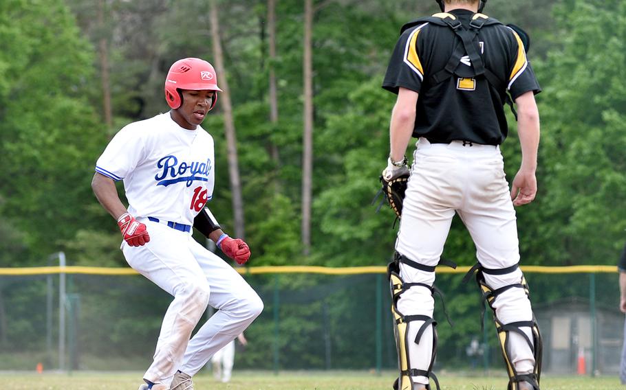 Ramstein sophomore Rueben Todman touches home plate during the Division I DODEA European championship game against Stuttgart on May 20, 2023, at Southside Fitness Center on Ramstein Air Base, Germany.