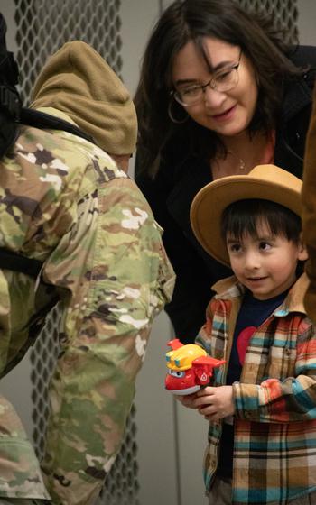 Family members welcome home soldiers from the 98th Support Maintenance Company (SMC), 17th Combat Sustainment Support Battalion, 11th Airborne Division, who returned to Joint Base Elmendorf-Richardson, Alaska, Thursday, March 28, 2024, after a nine-month deployment to Europe. 