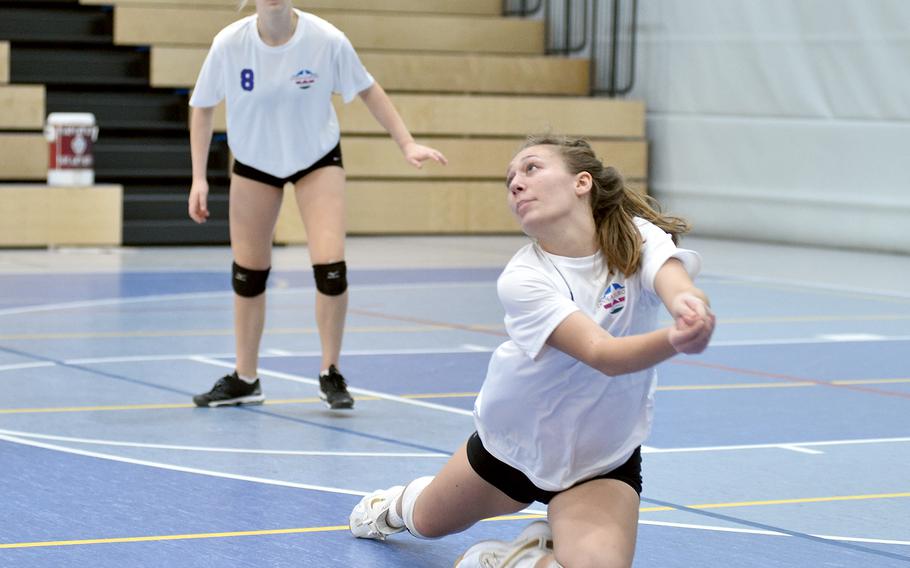 Vilseck’s Madison Bell of Team White watches the ball after a dig during the DODEA-Europe all-star volleyball matches Saturday at Ramstein High School on Ramstein Air Base, Germany. Teammate Chloe Aldrich follows the action.
