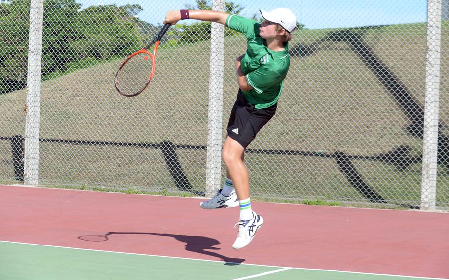 Kubasaki's Owen Ruksc serves during Thursday's Okinawa doubles tennis matches. Ruksc teamed with Jacy Fisk to beat Kadena's Maddux Fisk and Gabriiel Fino 8-6 in a two-hour boys match, then paired with Isabella Suber to down Kadena's Maddux Fisk and Brooke Brewer 7-5 in a mixed match.