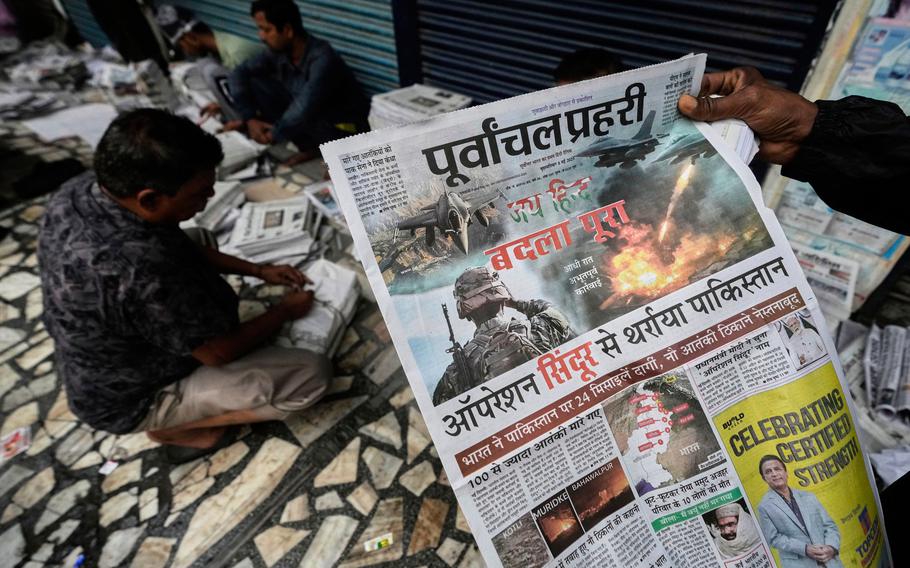 Vendors sort newspapers for distribution.