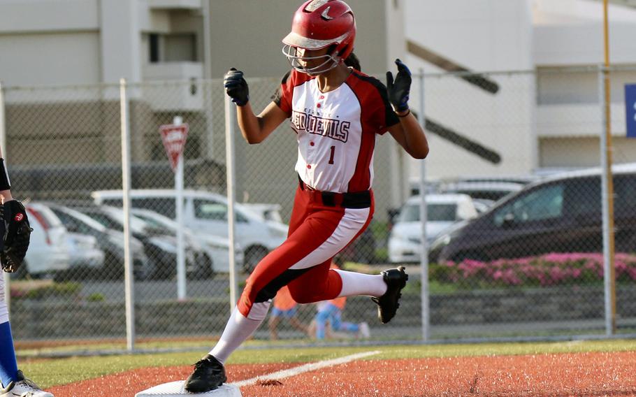 Reina Gardner steps on third.