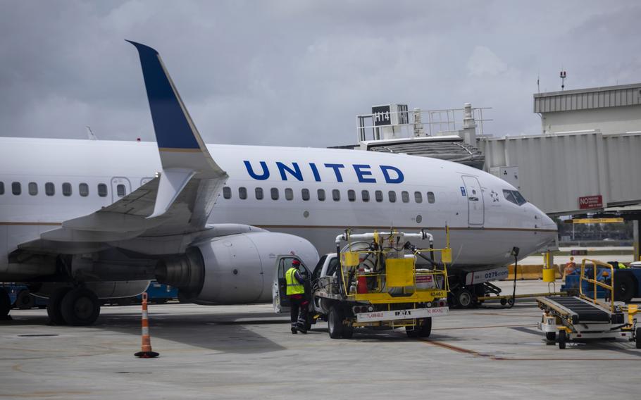 A passenger aircraft operated by United Airlines sits parked at Miami International Airport on June 16, 2021. 