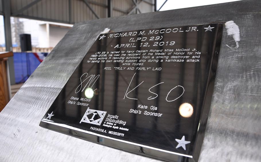 The keel plate of the future USS Richard M. McCool Jr. (LPD 29) sits on a podium during the ship’s keel authentication ceremony at Huntington Ingalls Industries Pascagoula shipyard April 12, 2019. 