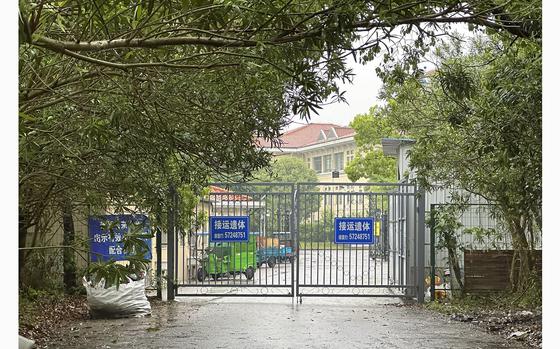 Buildings in the Shanghai Public Health Clinical Center stand near the entrance of the compound in Shanghai, China, on Tuesday, April 30, 2024. Zhang Yongzhen, the first scientist to publish a sequence of the COVID-19 virus, staged a sit-in protest after authorities locked him out of his lab at the center. 