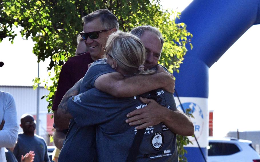 A man and woman embracing.