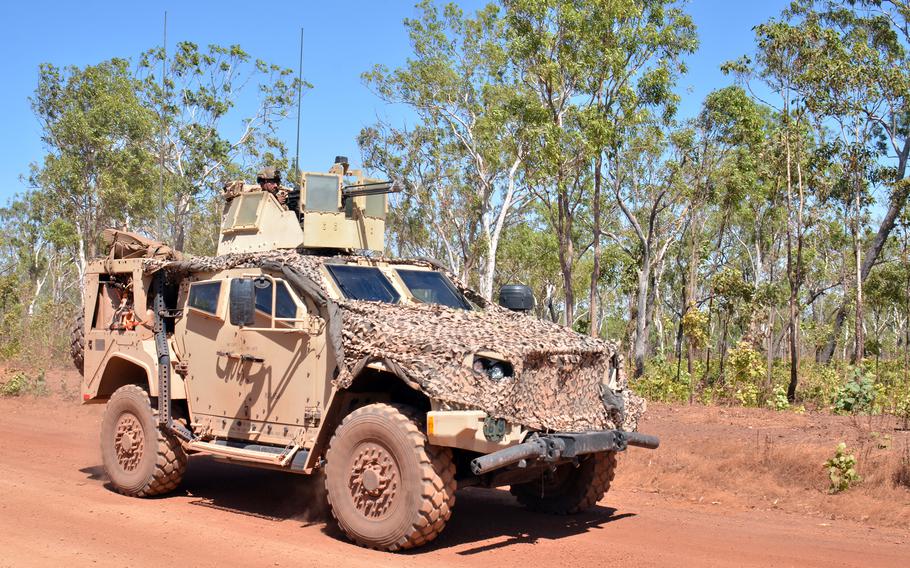 U.S. Marines move through Mount Bundey Training Area during Exercise Predator’s Run in Australia's Northern Territory, Wednesday, Aug. 24, 2022.