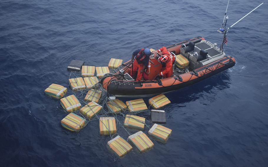A Coast Guard Cutter Forward (WMEC-911) boatcrew recovers multiple bales of cocaine, which totaled approximately 2,535 pounds, on Dec. 2, 2018 nearly 69 miles southwest of Malpelo Island, Colombia. The bales were jettisoned from a suspected drug smuggling vessel with three suspected smugglers aboard.