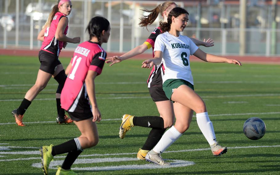 Kubasaki's Amaya Schaffeld drives the ball upfield against Kadena during Wednesday's Okinawa girls soccer match. The Dragons won 1-0.