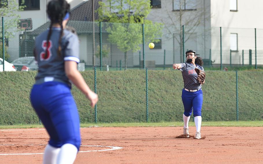 Ramstein shortstop Ania Edwards throws the ball to first baseman Jazmyn Hall during the first game of an April 13, 2024, doubleheader against Lakenheath on Ramstein Air Base, Germany.