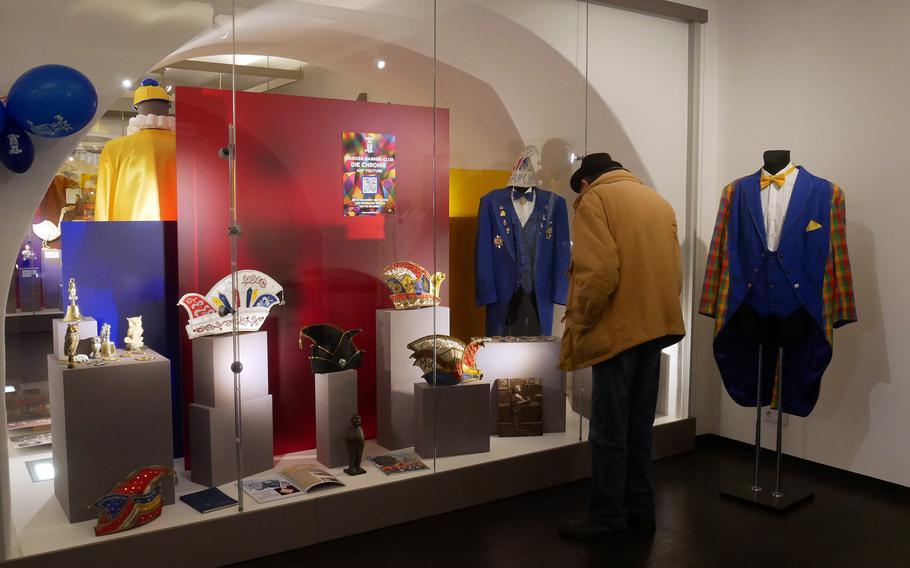 A visitor checks out a display of carnival hats and clothes at the Mainz Fastnachtsmuseum. It traces the history of carnival in Mainz from its 19th-century beginnings to the present.