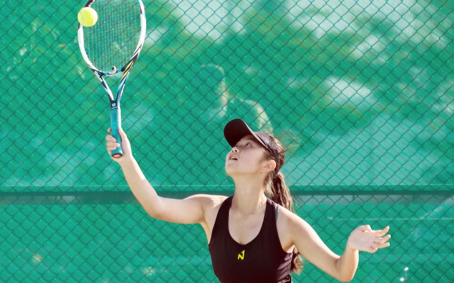 Humphreys' Grace Son hits an overhead shot during Wednesday's DODEA-Korea tennis matches. Son and her teammate Lizzy Brown beat Osan's Abigail Robertson and Lauren Suh 8-0.