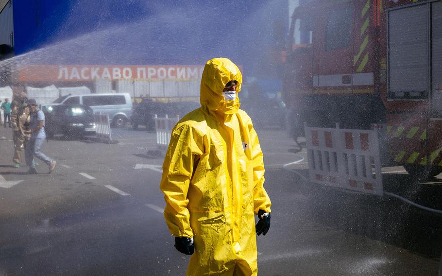 A Ukrainian Emergency Ministry rescuer attends an exercise in the city of Zaporizhzhia on Aug. 17, 2022, in case of a possible nuclear incident at the Zaporizhzhia nuclear power plant located near the city. 