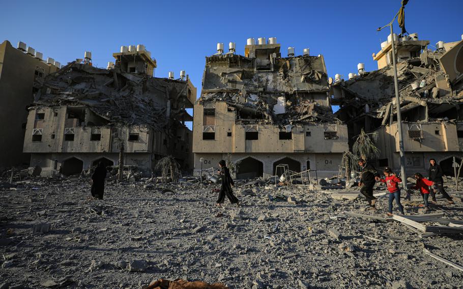 Residents leave the Hamad Towers area of Khan Younis on Dec. 2, 2023, after Israeli attacks.