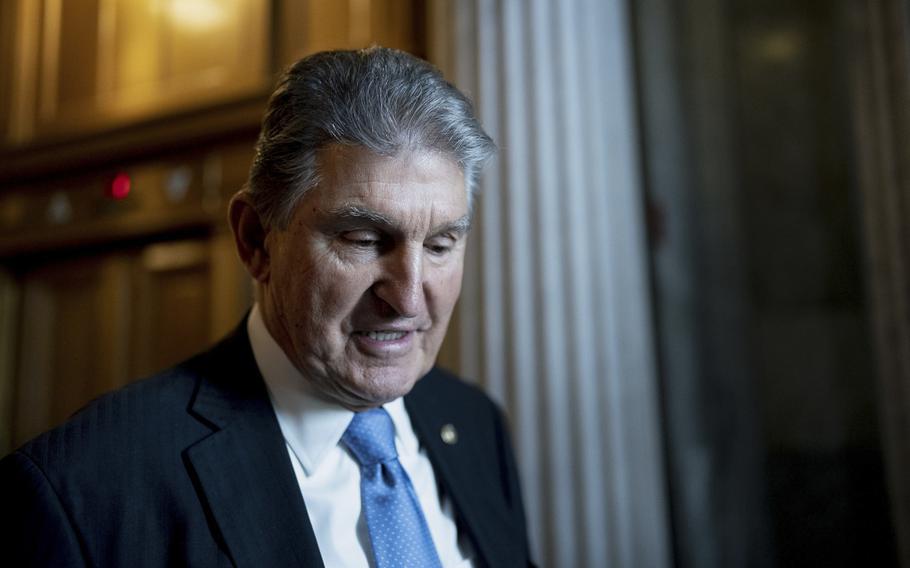 Sen. Joe Manchin, D-W.Va., departs the Senate Chamber at the U.S. Capitol in Washington, D.C., on Dec. 9, 2021.