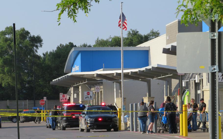 Police block an entrance to a Walmart.