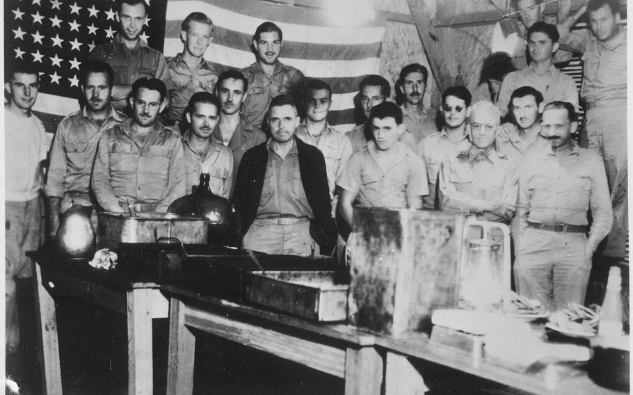 American prisoners of war celebrate the 4th of July in the Japanese prison camp of Casisange in Malaybalay, on Mindanao, Philippine Islands, in 1942. It was against Japanese regulations and discovery would have meant death, but the men celebrated the occasion anyway.