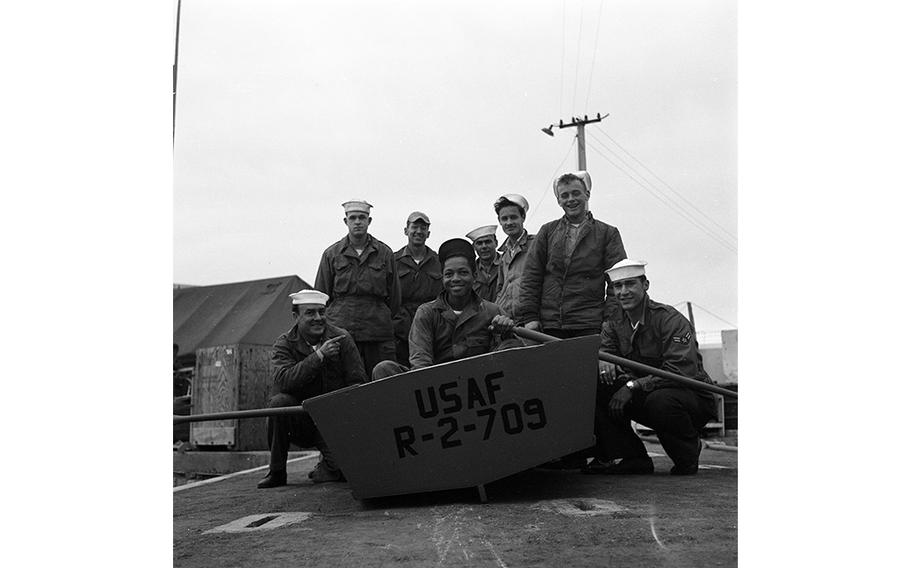 Members of the 7th Crash Rescue Boat Flight, the seagoing flyboys, on the dock at Tripoli harbor, Libya.