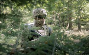 Pfc. Jaiden Ramos of the 2nd Theater Signal Brigade patrols the woods during a chemical, biological, radiological and nuclear materials event at the U.S. Army Europe and Africa Best Squad Competition at Grafenwoehr Training Area, Germany, on Aug. 25, 2025. 