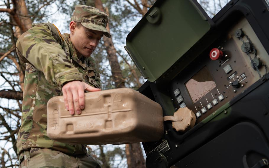 Pfc. Andrii Sydoruk fuels a machine during a training exercise Feb. 9, 2024, in Landstuhl, Germany. The petroleum supply specialist has served as a linguist for Ukrainian soldiers learning to operate American air defense systems. 
